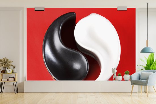 Cendrier Yin et Yang devant un fond d' fotobehang rouge