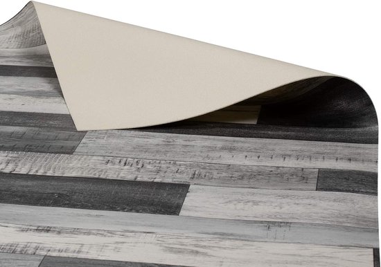 Sol décoratif en PVC aspect planches de bois vieilli, teintes de gris et blanc. Le dos est gris clair.