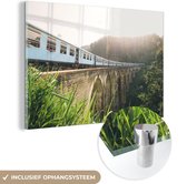 MuchoWow® Glasschilderij 180x120 cm - Schilderij acrylglas - Een trein over een brug - Foto op glas - Schilderijen