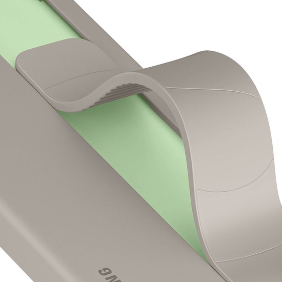 Close-up van de beige gripband die omhoog staat, met een groene voering.