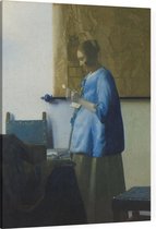 Brieflezende vrouw in blauw, Johannes Vermeer - Foto op Canvas - 45 x 60 cm