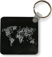 Sleutelhanger - Wereldkaart - Zwart - Wit- Sterrenhemel - Plastic