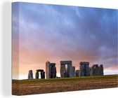 Canvas schilderij 180x120 cm - Wanddecoratie Unieke paarse lucht boven de Stonehenge in Engeland - Muurdecoratie woonkamer - Slaapkamer decoratie - Kamer accessoires - Schilderijen