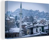 Canvas Schilderij Winterse skyline van Sarajevo in Bosnië en Herzegovina - 60x40 cm - Wanddecoratie