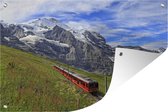 Tuinposter 120x80 cm - Tuindecoratie Trein rijd over Jungfraujoch - Poster voor in de tuin - Buiten decoratie - Schutting tuinschilderij - Tuindoek muurdecoratie - Wanddecoratie balkondoek