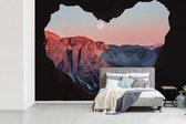 Behang - Fotobehang Zonsondergang vanuit grot - Breedte 360 cm x hoogte 240 cm