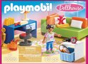 Doos van PLAYMOBIL Dollhouse speelgoedkamer met kinderfiguur, bank, bureau en accessoires.