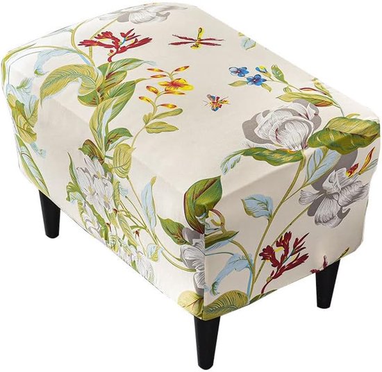 Lichtgekleurde ottomaanse hoes met een bloemen- en bladerenprint, op vier zwarte pootjes.