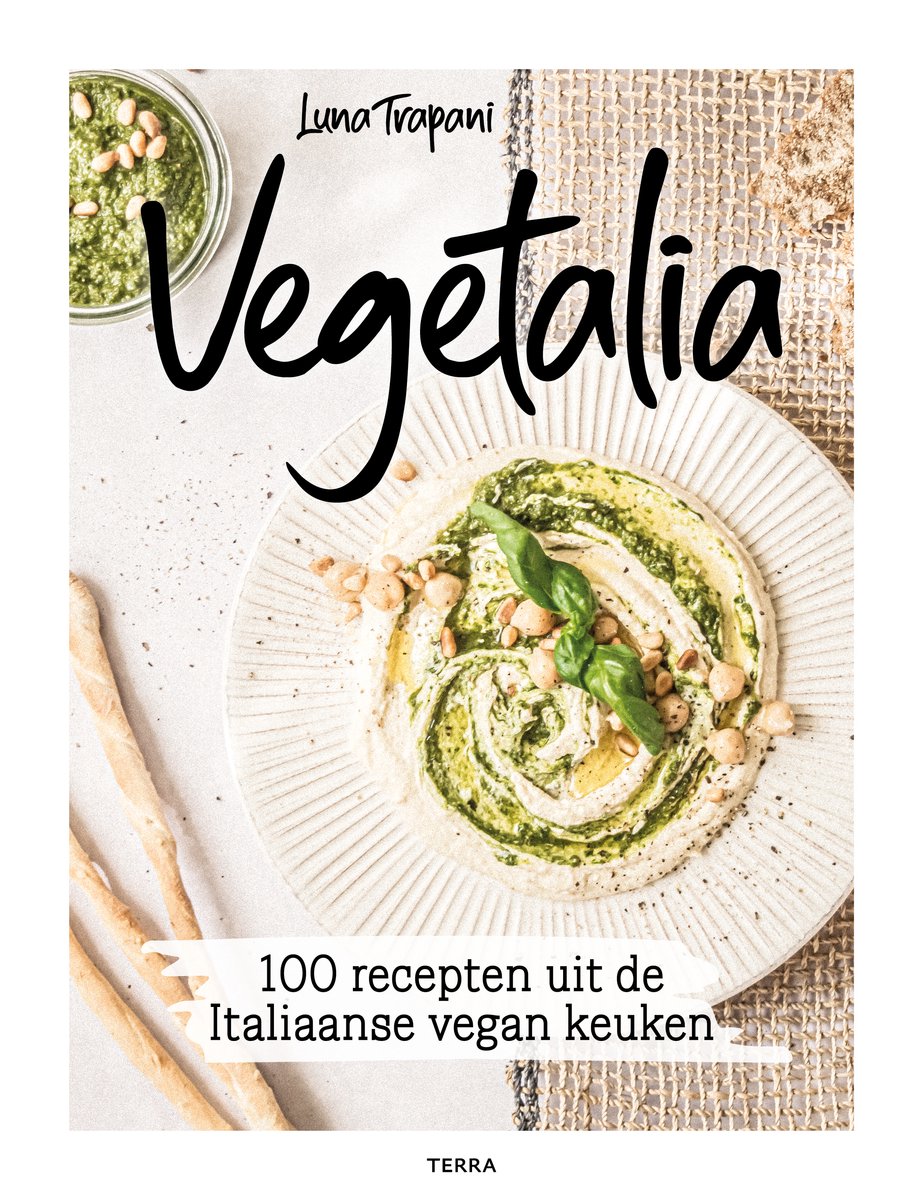 Voorpagina van het kookboek Vegetalia, met een veganistisch gerecht van hummus en pesto.