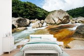 Behang - Fotobehang Water tussen de rotsen van het Aziatische Yakushima in Japan - Breedte 450 cm x hoogte 300 cm
