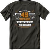 45 Jaar Legend T-Shirt | Goud - Wit | Grappig Verjaardag en Feest Cadeau Shirt | Dames - Heren - Unisex | Tshirt Kleding Kado | - Donker Grijs - L