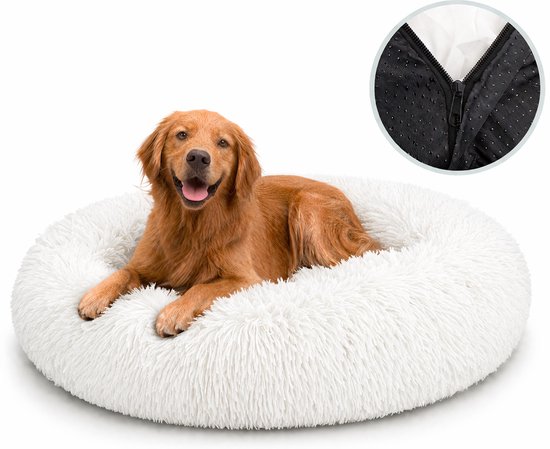 Un golden retriever dans un panier donut blanc moelleux, avec un détail de la fermeture éclair et des picots antidérapants.