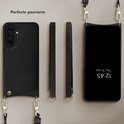 Zwarte lederen telefoonhoes, zijaanzichten en telefoon met koord en pashouder.