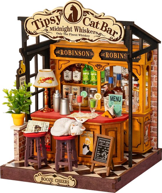 Miniatuur 'Tipsy Cat Bar' met een toonbank, krukjes, drankjes en een slapende witte kat.