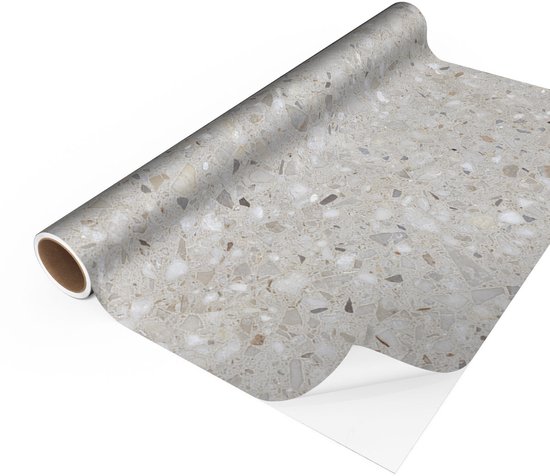 Zelfklevende vloerbedekking op rol met een grijze terrazzo print met kleine steentjes.