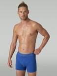 Man draagt een blauwe Muchachomalo boxershort met grijze logoband.