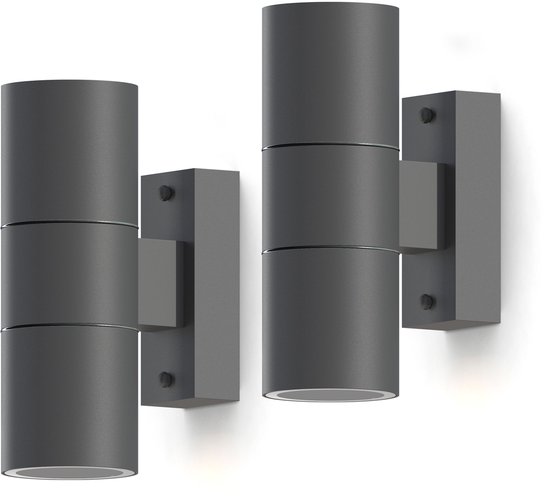 Deux appliques murales cylindriques gris foncé, chacune avec deux sources lumineuses, montées sur une base rectangulaire.
