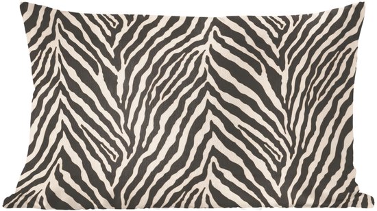 Coussin avec imprimé zèbre noir et blanc.