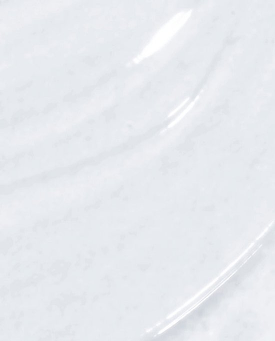 Een close-up van de witte, glanzende textuur van top coat.