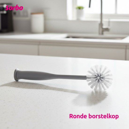 Grijze Sorbo afwasborstel met ronde witte borstelkop, liggend op een aanrecht. "Ronde borstelkop"