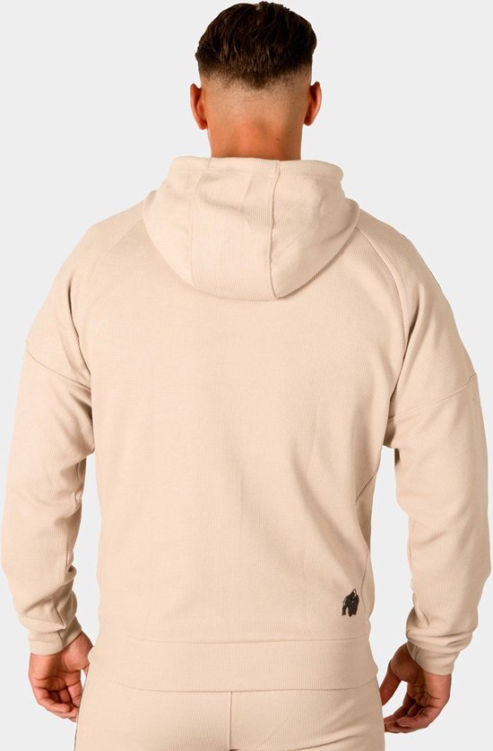 Achterkant beige Gorilla Wear trainingsjack met capuchon en logo op de rug.