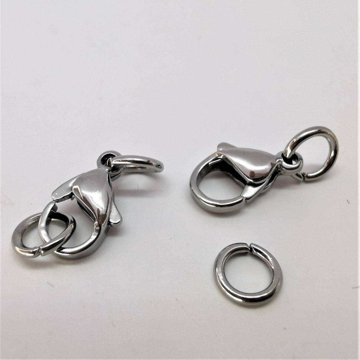 Karabijn sluiting 8 setje Zilverkleurig Roestvrij staal (RVS) , 12mm incl 2 open ring van 4 mm.