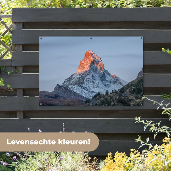 Tuinposter 120x80 cm - Tuindecoratie De Matterhorn in Zwitserland bij zonsopkomst - Poster voor in de tuin - Buiten decoratie - Schutting tuinschilderij - Tuindoek muurdecoratie - Wanddecoratie balkondoek