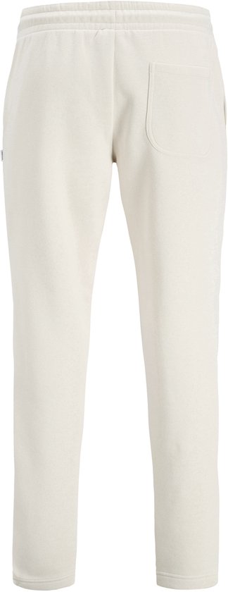 Crème joggingbroek met elastische tailleband en achterzak.