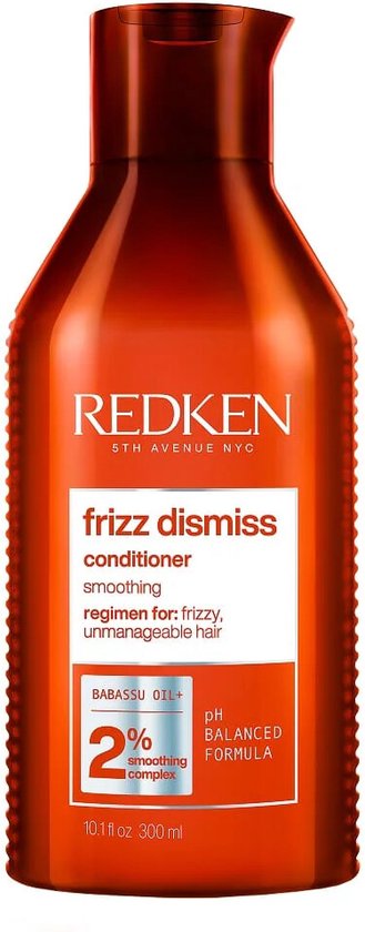 Bouteille orange de revitalisant Redken Frizz Dismiss avec "régime pour cheveux frisés et indisciplinés".