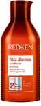 Bouteille orange de revitalisant Redken Frizz Dismiss avec "régime pour cheveux frisés et indisciplinés".