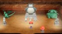 Een beeld van Snorlax, Venusaur en Charizard in een grot.