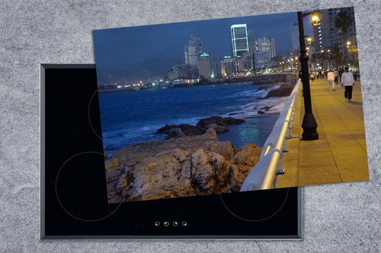 KitchenYeah® Inductie beschermer 78x52 cm - Uitzicht op de kustlijn van Beiroet in Libanon - Kookplaataccessoires - Afdekplaat voor kookplaat - Inductiebeschermer - Inductiemat - Inductieplaat mat - Merkloos