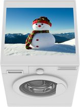 Wasmachine beschermer mat - Een kerstpop in het besneeuwde landschap tijdens de winter - Breedte 55 cm x hoogte 45 cm