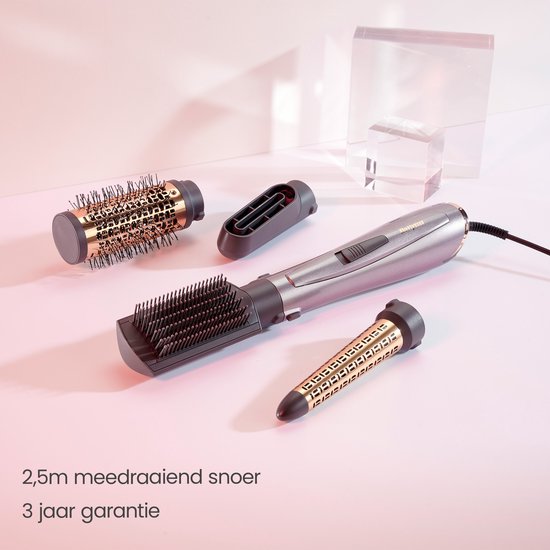 Grijze 1000W föhnborstel met drie opzetstukken, een 2,5 meter meedraaiend snoer en 3 jaar garantie.