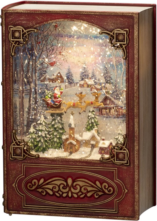Livre décoratif lumineux style rouge antique avec un paysage de Noël, le père Noël et un traîneau sous la neige.