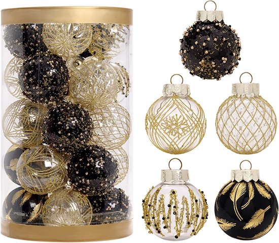 Tube contenant diverses boules de Noël dorées et noires et ornements séparés.