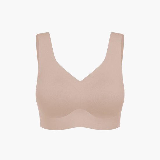 Beige naadloze minimizer-beha zonder beugel met een V-hals en brede schouderbanden voor extra rugondersteuning.