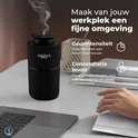 Zwarte, geribbelde Aroma diffuser op een bureau, ideaal voor concentratieboost.