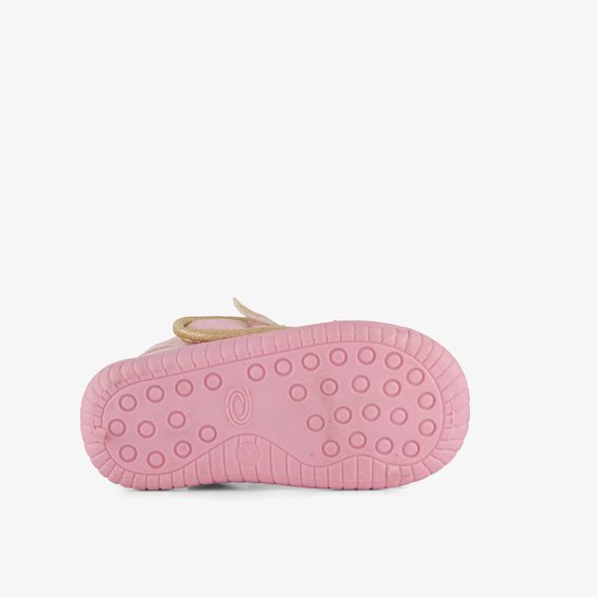 Onderkant van roze pantoffel met antislip zool met ronde nopjes.