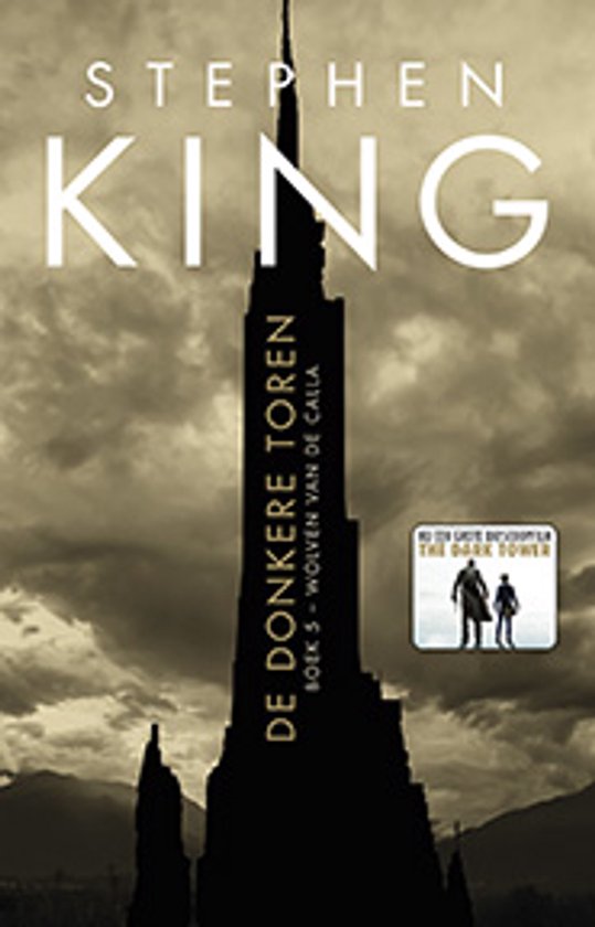Boekomslag van De Donkere Toren 5 - Wolven van de Calla, met een silhouet van een toren tegen een dramatische hemel.