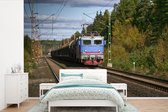 Un train sur un chemin de fer papier peint photo vinyle largeur 330 cm x hauteur 220 cm - Tirage photo sur papier peint (disponible en 7 tailles)