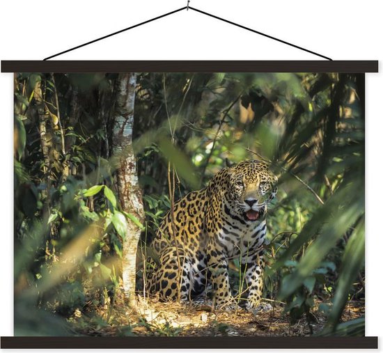 Un jaguar photographié parmi les feuilles de la jungle luxuriante affiche textielposter 60x45 cm