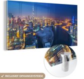 MuchoWow® Glasschilderij 80x40 cm - Schilderij acrylglas - Dubai als een schitterende lichtgevende stad in de nacht - Foto op glas - Schilderijen