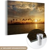 MuchoWow® Glasschilderij 120x80 cm - Schilderij acrylglas - Palmbomen bij zonsondergang - Foto op glas - Schilderijen