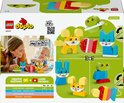 Achterkant LEGO Duplo doos 10477 met afbeeldingen van kinderen die spelen met Duplo dieren.