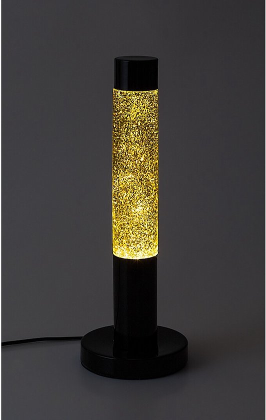 Zwarte lavalamp met een transparante cilinder gevuld met gele vloeistof en glitters, met een cirkelvormige voet.