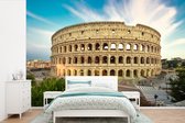 Behang - Fotobehang Roman Colosseum Rome bij zonsondergang - Breedte 450 cm x hoogte 300 cm