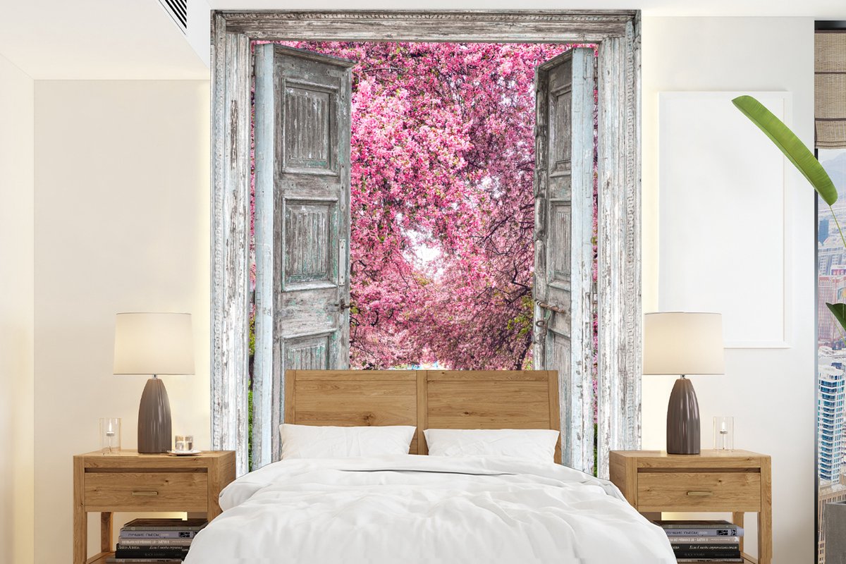 Behang - Fotobehang Sakura - Doorkijk - Boom - Kersenbloesem - Breedte 195 cm x hoogte 260 cm