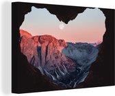 Canvas Schilderij Zonsondergang vanuit grot - 120x80 cm - Wanddecoratie