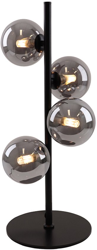 Lampe de table noire avec pied rond, tige verticale et quatre globes en verre gris aux lampes allumées.